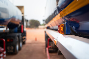 Turing lighting signal on the side of crude oil or chemical road tanker truck. Transportation...
