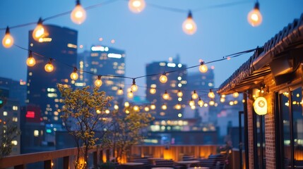 String lights illuminate a rooftop patio at dusk in city