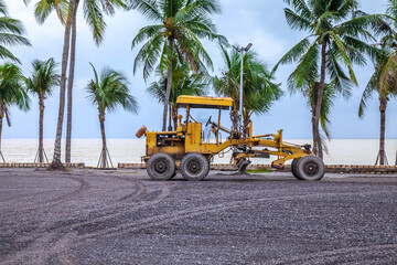 Motor grader tractor working at road construction site