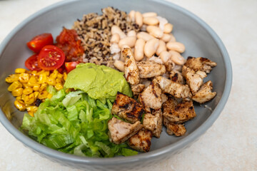 Fiesta bowl, Mexican food dish bowl with chicken, rice, corn and vegetables. Taco or burrito bowl. 