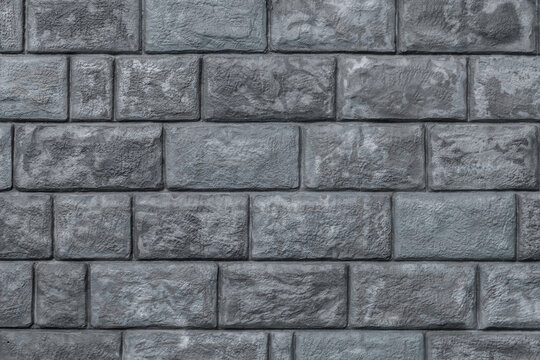 Fototapeta Gray brick wall with a gray brick