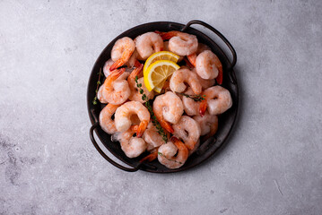 Frozen uncooked prawns or shrimps with lemon