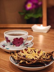 Enjoying a quiet moment with sweet treats and fragrant tea in a cozy setting during a serene afternoon