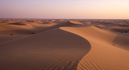 Desert landscape, rolling sand dunes, large setting sun.
