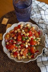 homemade chickpea salad with tomatoes and peppers