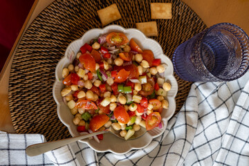 homemade chickpea salad with tomatoes and peppers