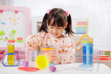 A young girl was conducting a science experiment at home.	
