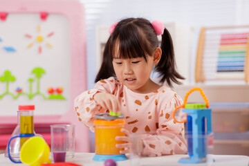 A young girl was conducting a science experiment at home.	
