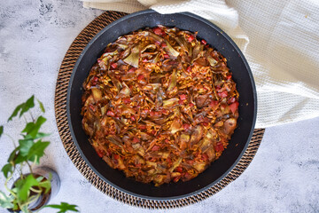 rice paella with artichokes and vegetables