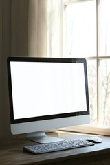 Fototapeta premium A computer monitor sits on a wooden desk, providing a functional workspace