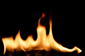 Fototapeta premium Vibrant Flames Creating Warmth and Light Against a Black Background