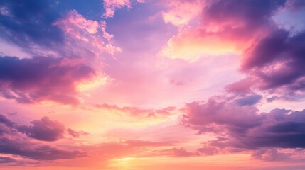 Obraz premium A breathtaking sunset sky with vibrant hues of pink and purple clouds, creating a serene and calming atmosphere.