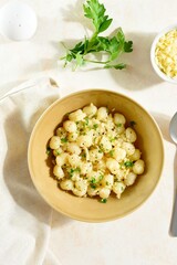 Potato gnocchi with parmesan cheese and greens