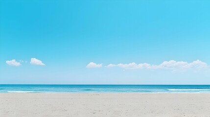 Obraz premium Tranquil Beach Scene with Blue Sky and White Sand