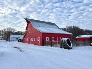 An old Monitor style barn with beautiful cloud textured sky