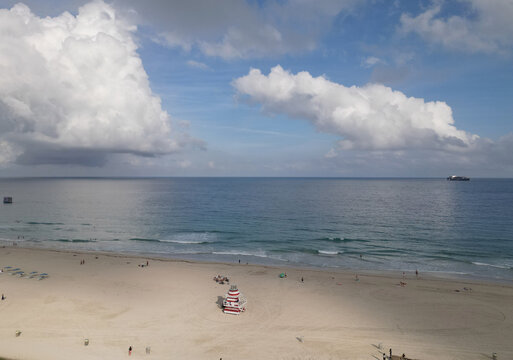 Lifeguard station at beach with cloudy horizon. Lifeguard tower at the sea beach. Summer vacation. Vacation on summer seaside. Relax at the sea. Lifeguard on beach in Miami. Travel and sea resort