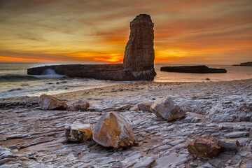 A few boulders, a Sea Stack and a Sunset