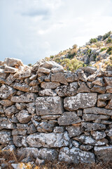 Ancient wall texture background with old bricks and stones