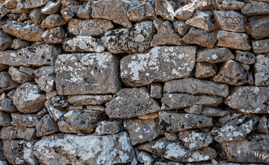 Ancient wall texture background with old bricks and stones