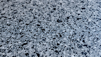 Textured Granite Surface with Speckled Patterns and Rough Finish – Ideal for Natural and Industrial Design Projects