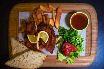 Small tomatoes, lettuce, and nuggets