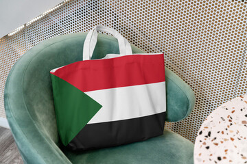 Shopping bag with the flag of Sudan 3D Rendering