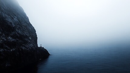Solitary Lighthouse on a Misty Coastal Cliff