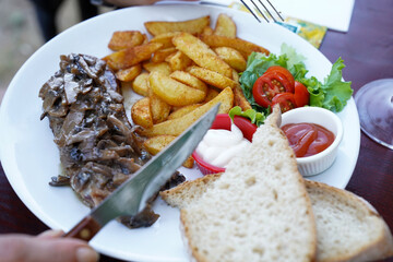 Potato bread and sauce in the entrecôte plate with Creamy Mushroom Sauce at the restaurant