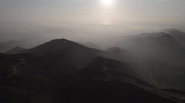 Clouds Surrounding the Deserted and Dry Hills at the Viewpoint Known as &ldquo;Apu Siqay&rdquo; in Villa del Triunfo, Lima, Peru at Sunset  