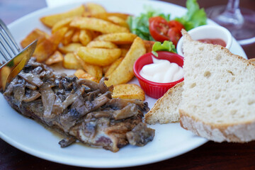 Potato bread and sauce in the entrecôte plate with Creamy Mushroom Sauce at the restaurant