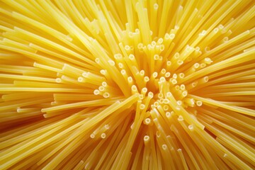 A vibrant burst of golden pasta strands.