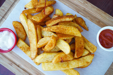In the restaurant, served with fried potatoes, ketchup and mayonnaise