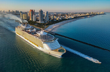 Cruise ship tour and travel at sea. Aerial view of luxury liner voyage. Ship leaving Miami beach...