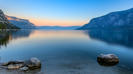 Serene Sunset Over Mountain Lake Rocks