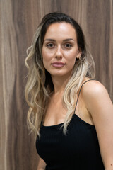 Naklejka premium Elegant Blonde in a Black Dress Exuding Confidence and Timeless Beauty.