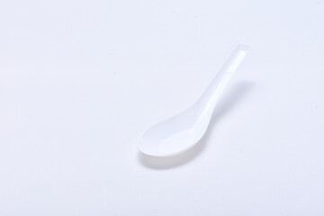 White plastic spoon isolated on white background