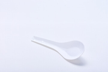 White plastic spoon isolated on white background