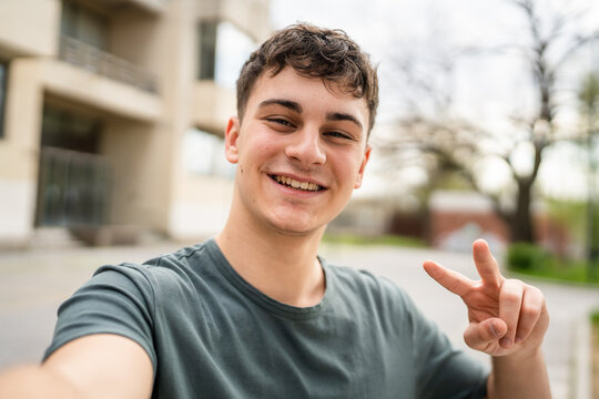 portrait of young Caucasian man teenager 18 or 19 years old outdoor