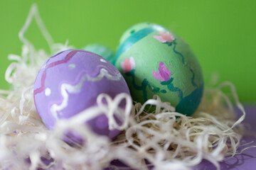 Group of vintage colored Easter eggs decorated by hand .