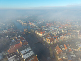 high altitude drone aerial of historic city Sneek Friesland with canal and water gate
