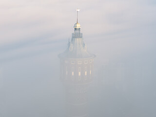 sunrise fog mist morning aerial of historic water tower Sneek the netherlands
