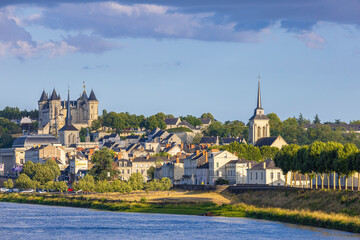 Fototapeta premium Saumur, France, located at the Loire river under a beautiful cloudscape during daytime.