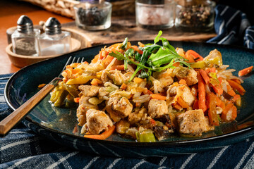 Fried chicken pieces with vegetables.