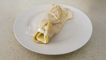 Quesillo, a typical Nicaraguan food made of cheese, cream and pickled onions. served in a plastic bag
