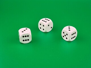 Dice on a green background. Casino - entertainment and fun.
