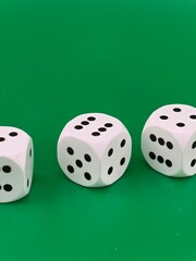 Dice on a green background. Casino - entertainment and fun.
