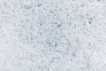 Ice texture crystal, blue tones background. Textured cold frosty surface of ice.