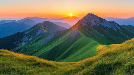 Obraz premium Sunrise over green mountain range, scenic view