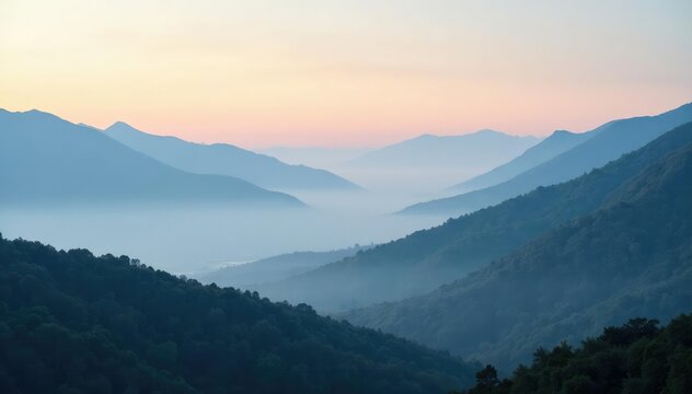 Foggy landscape with misty mountains in distance, cloudy horizon, fog