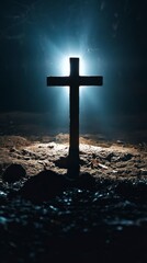 Naklejka premium Cross shining with light from above, illuminating the darkness below. The background is dark and gloomy. 